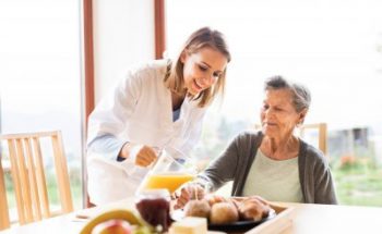 nurse taking care of the old lady